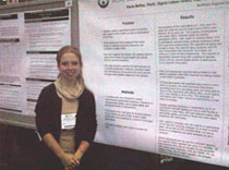 Dr. Paola Bailey next to her poster: socialization patterns in patients with epilepsy