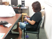 Knitting instructor preparing for purple day.