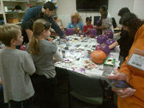 Busy hands painting pumpkins for epilepsy